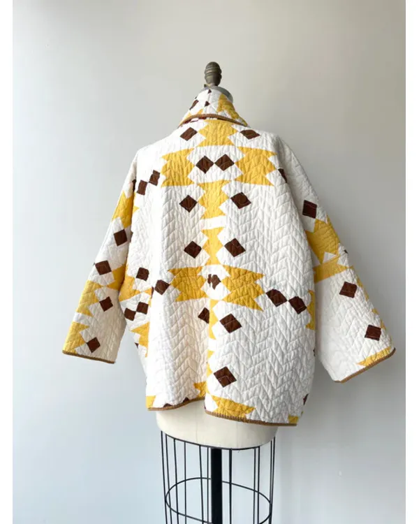 The Parenting 2025 Parker Posey Yellow & White Quilted Coat